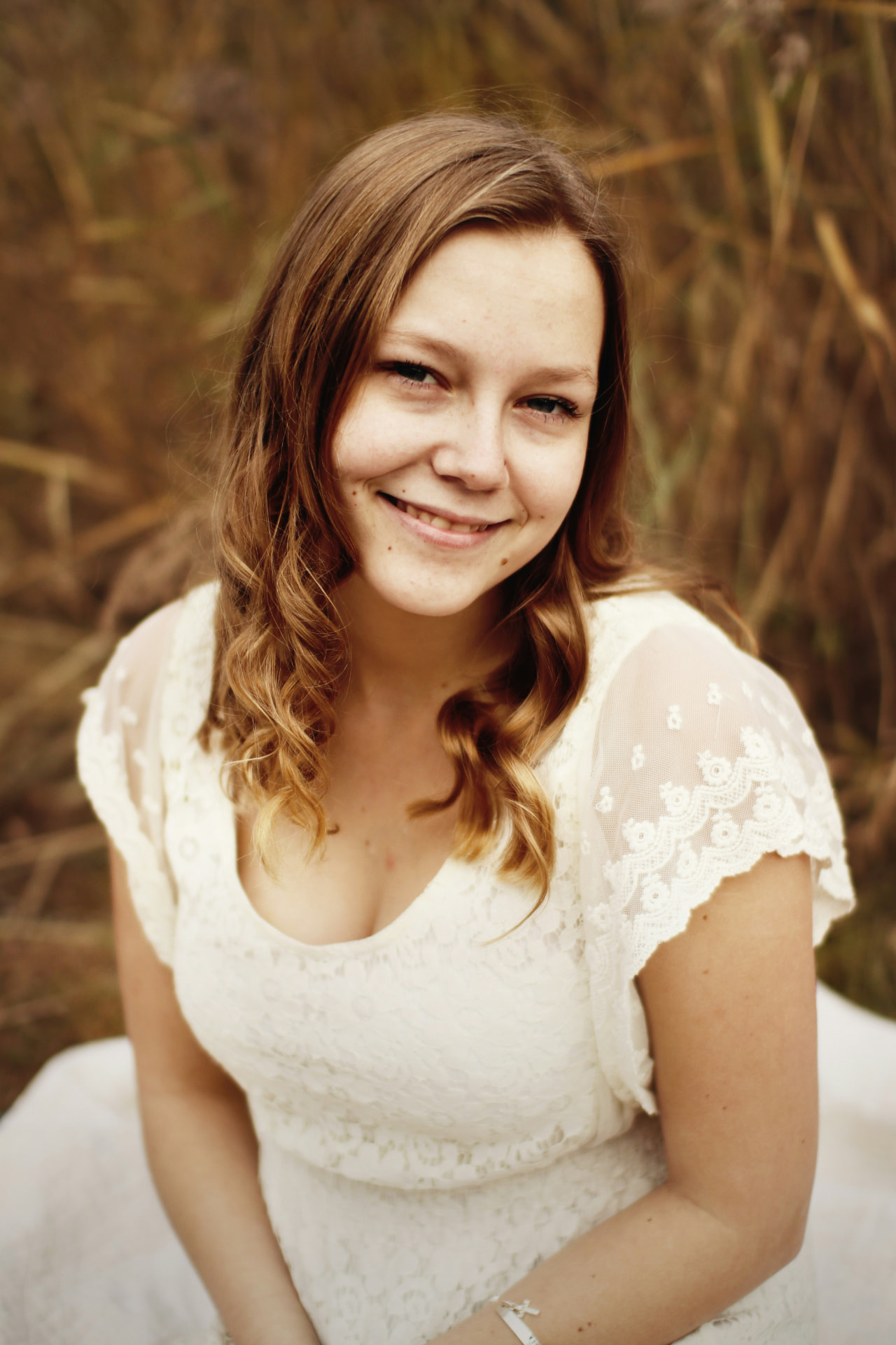 Portrait of a smiling young woman representing the C.E.S Imagery primary persona