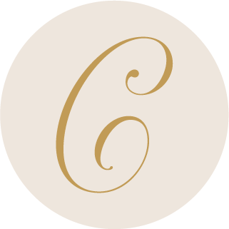 C.E.S Imagery gold script C monogram on a warm off-white circle